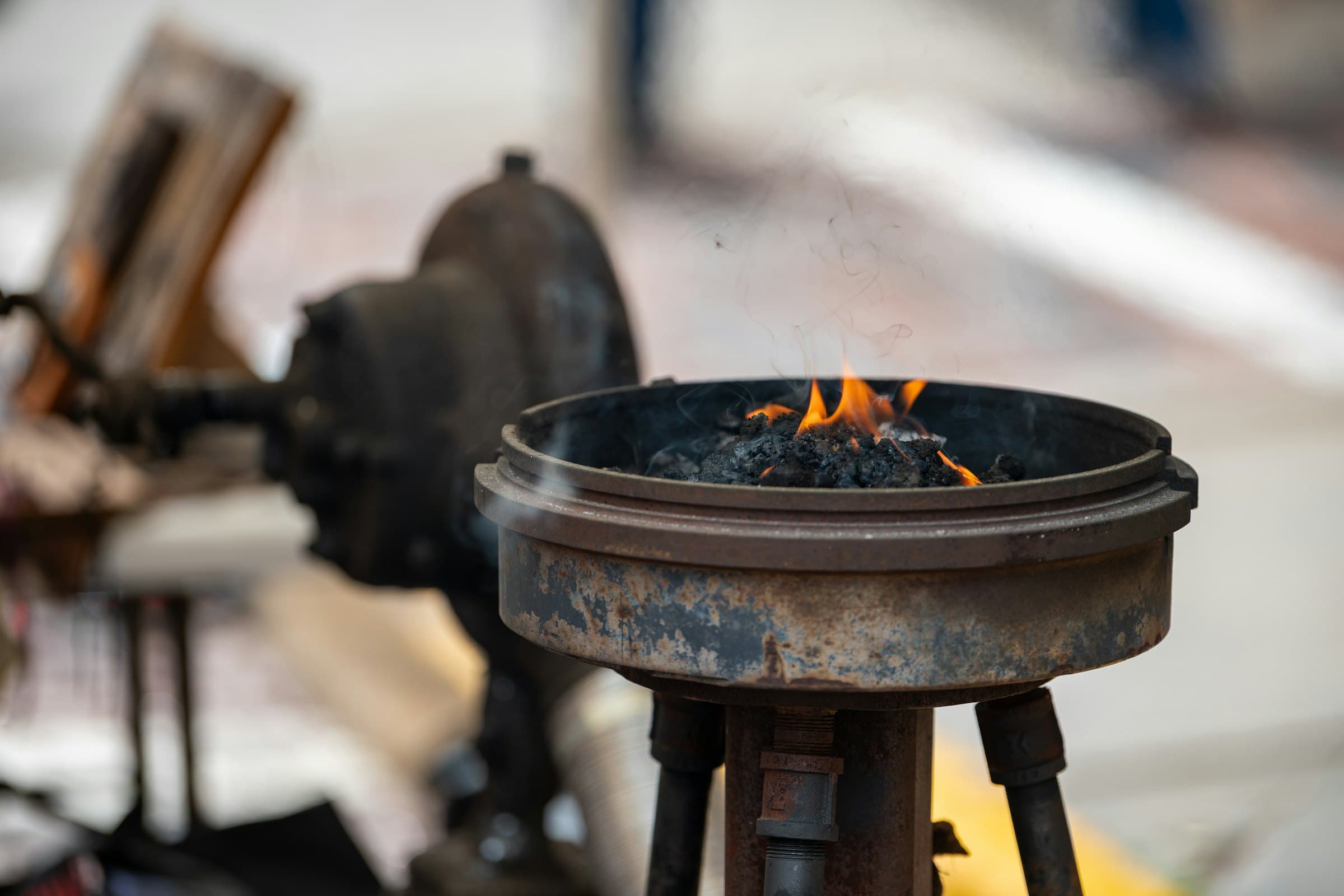 Burning coals and flame in an open forge